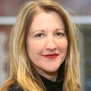 Head shot of Ruth Abrams smiling into camera