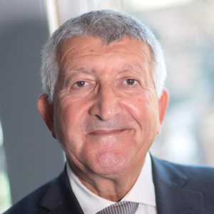 Head shot of Joseph Kosky smiling into camera